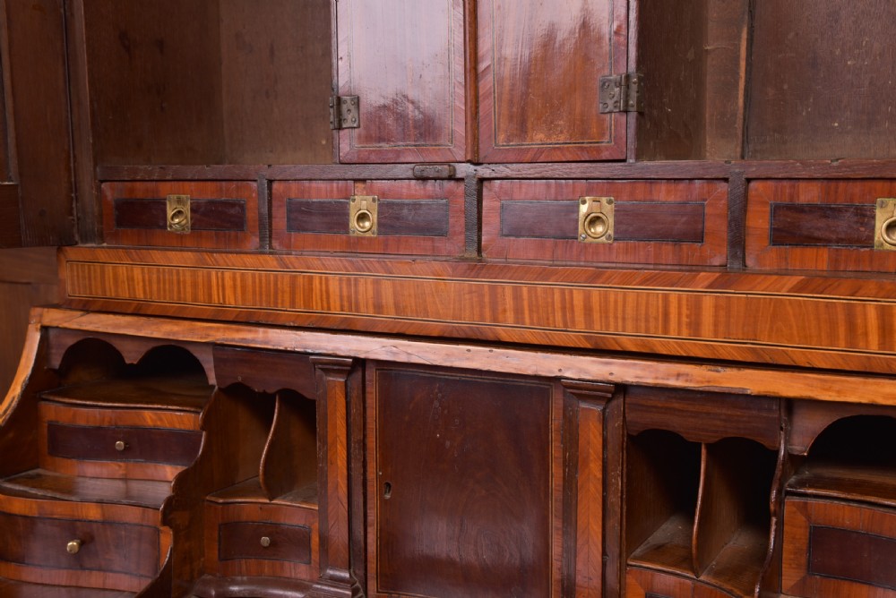 An 18th-century Dutch walnut bombe bureau bookcase featuring inlaid bird motifs, a sloping drop-front desk, shaped drawers, and carved claw feet. View XI