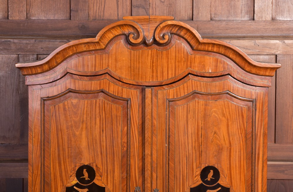 An 18th-century Dutch walnut bombe bureau bookcase featuring inlaid bird motifs, a sloping drop-front desk, shaped drawers, and carved claw feet. View XXI