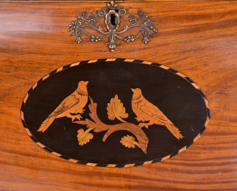 An 18th-century Dutch walnut bombe bureau bookcase featuring inlaid bird motifs, a sloping drop-front desk, shaped drawers, and carved claw feet. View XXIII
