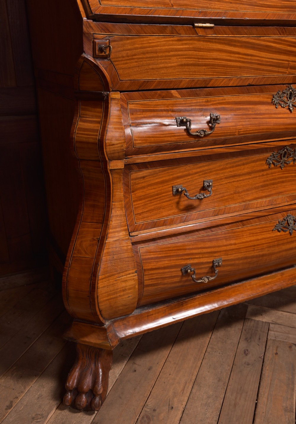 An 18th-century Dutch walnut bombe bureau bookcase featuring inlaid bird motifs, a sloping drop-front desk, shaped drawers, and carved claw feet. View XXVI