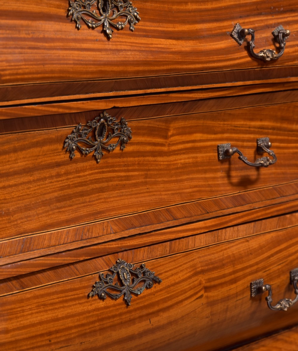 An 18th-century Dutch walnut bombe bureau bookcase featuring inlaid bird motifs, a sloping drop-front desk, shaped drawers, and carved claw feet. View XXVII