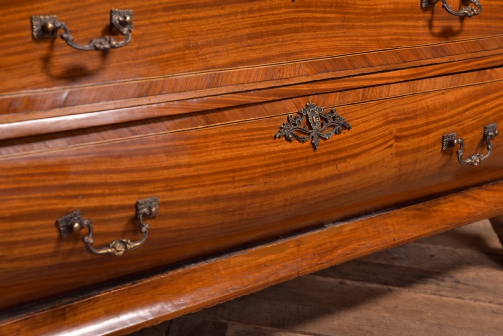 An 18th-century Dutch walnut bombe bureau bookcase featuring inlaid bird motifs, a sloping drop-front desk, shaped drawers, and carved claw feet. View XXIX