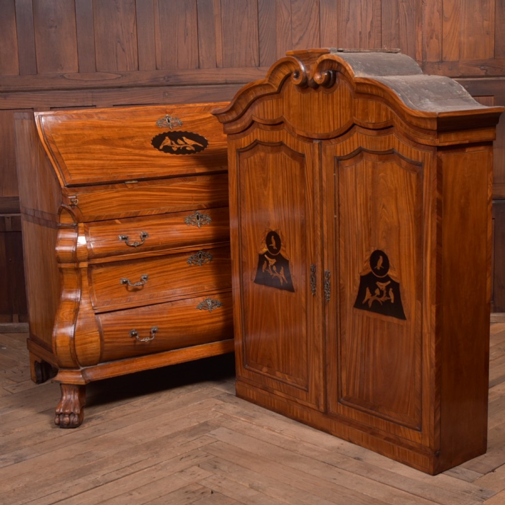 An 18th-century Dutch walnut bombe bureau bookcase featuring inlaid bird motifs, a sloping drop-front desk, shaped drawers, and carved claw feet. View XXXI