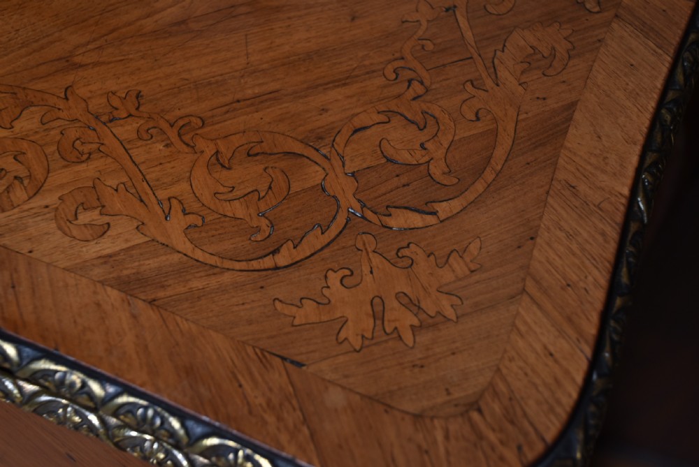 A Victorian Louis XV style marquetry card table featuring cabriole legs, brass mounts, a serpentine apron, and a fold-over top. View VIII