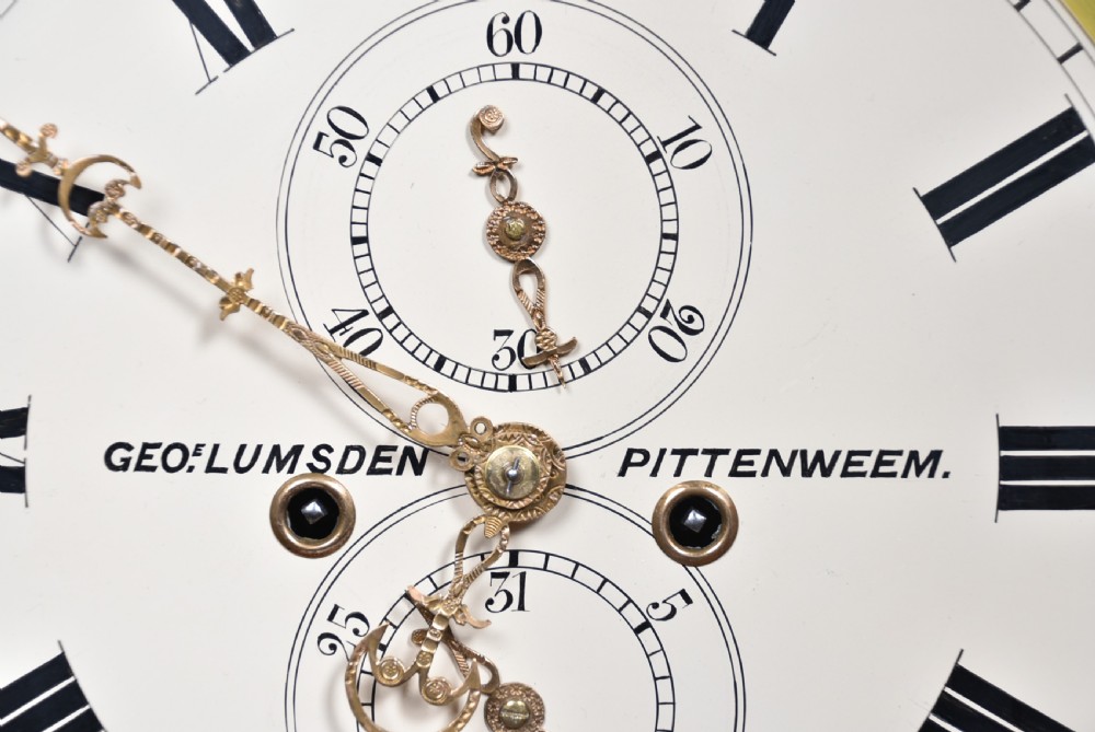 A nineteenth-century Scottish flame mahogany longcase clock featuring a swan-neck pediment, barley twist columns, and a hand-painted dial depicting sailing ships. View VI
