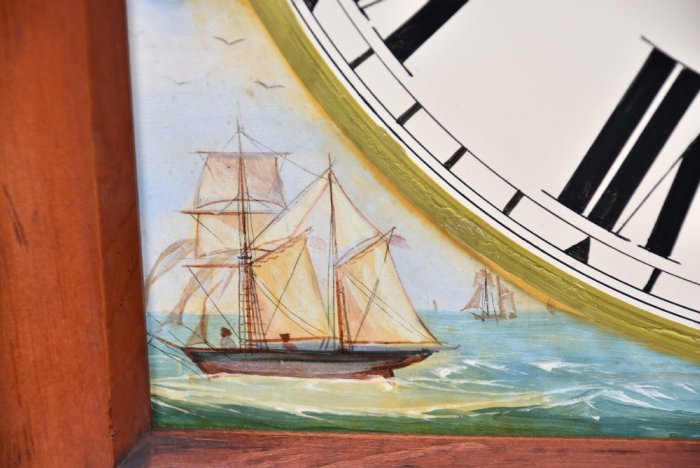 A nineteenth-century Scottish flame mahogany longcase clock featuring a swan-neck pediment, barley twist columns, and a hand-painted dial depicting sailing ships. View X