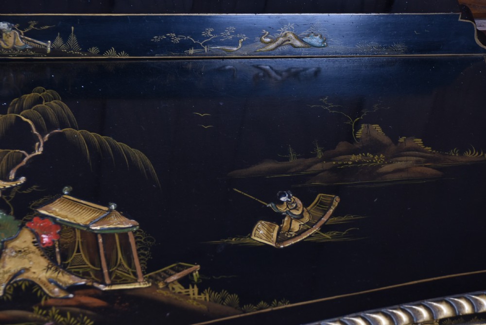 An Edwardian black lacquered display cabinet featuring hand-painted gold Chinoiserie motifs, arched astragal glazing, and cabriole legs. View XV