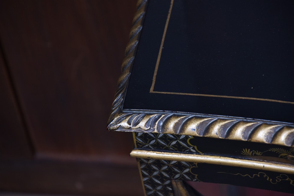 An Edwardian black lacquered display cabinet featuring hand-painted gold Chinoiserie motifs, arched astragal glazing, and cabriole legs. View XVI