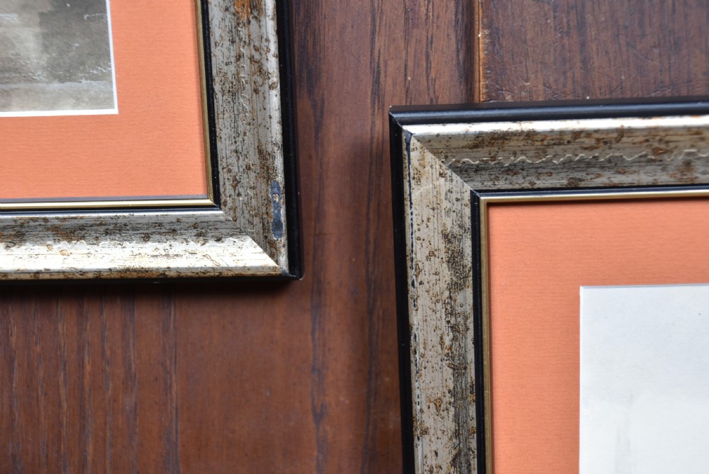 A pair of framed Victorian watercolour paintings depicting Dutch coastal scenes with windmills, boats, and canal buildings, finished with terracotta mounts and silvered frames. View XV