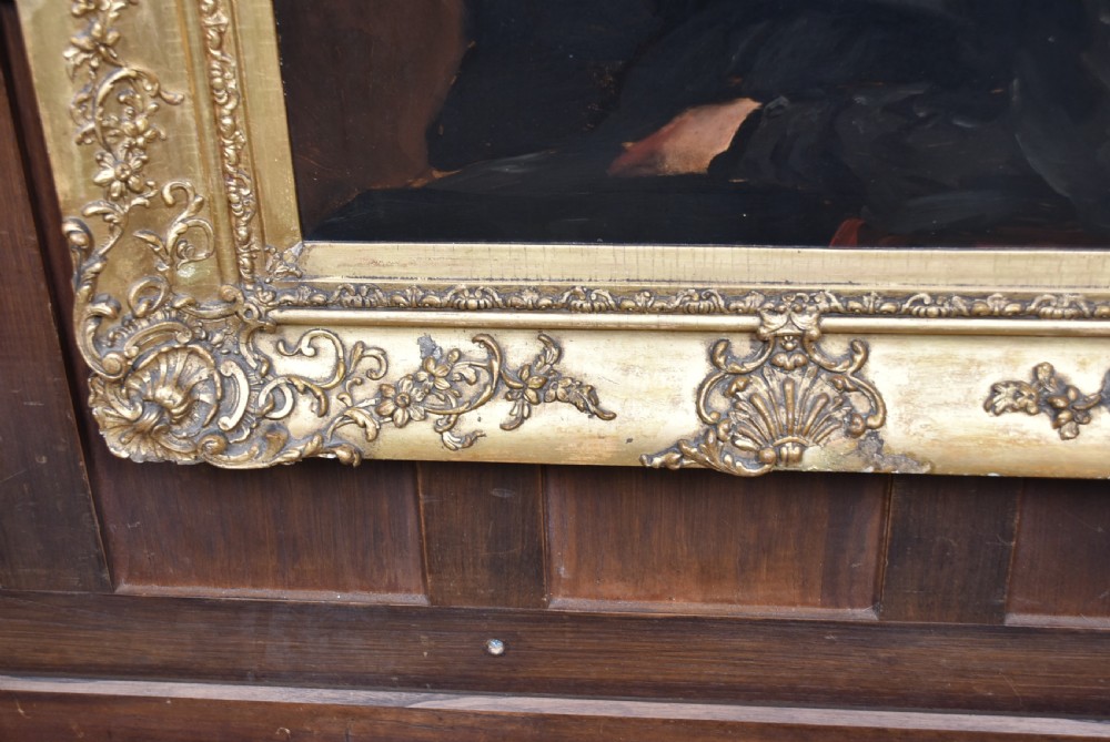 An antique 19th-century oil portrait painting on canvas depicting an elderly woman wearing a lace bonnet, set inside a heavy ornate giltwood frame. View VI