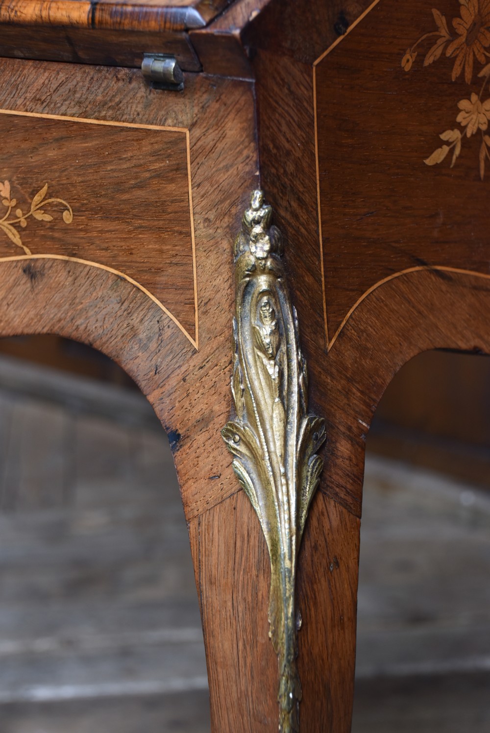 A Victorian marquetry bureau de dame desk featuring floral wood inlays, a slant front writing slope, pierced brass top gallery, and cabriole legs with brass mounts. View IX
