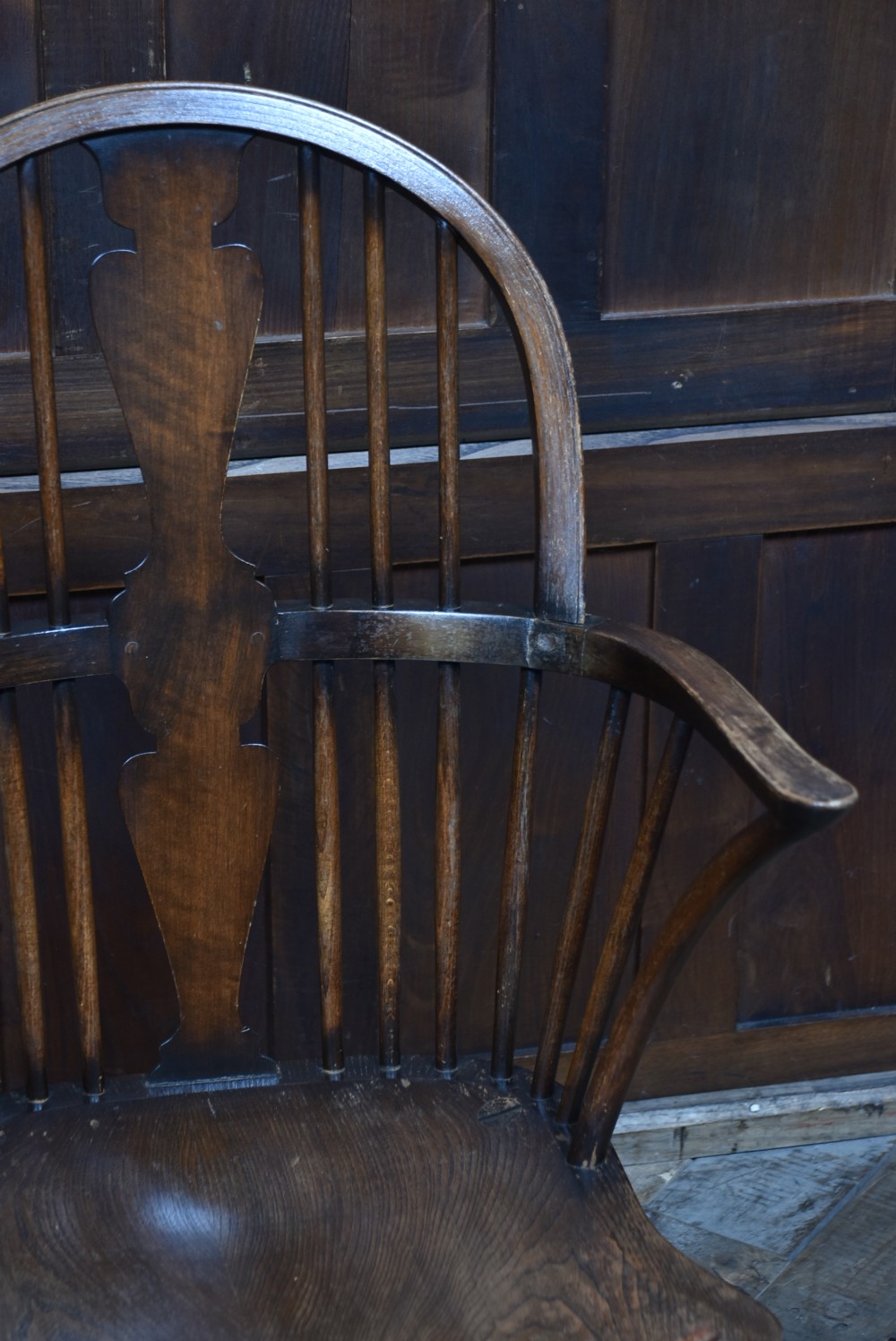 A pair of antique wooden Windsor armchairs featuring shaped back splats, curved arms, saddle seats, and cabriole front legs. View V