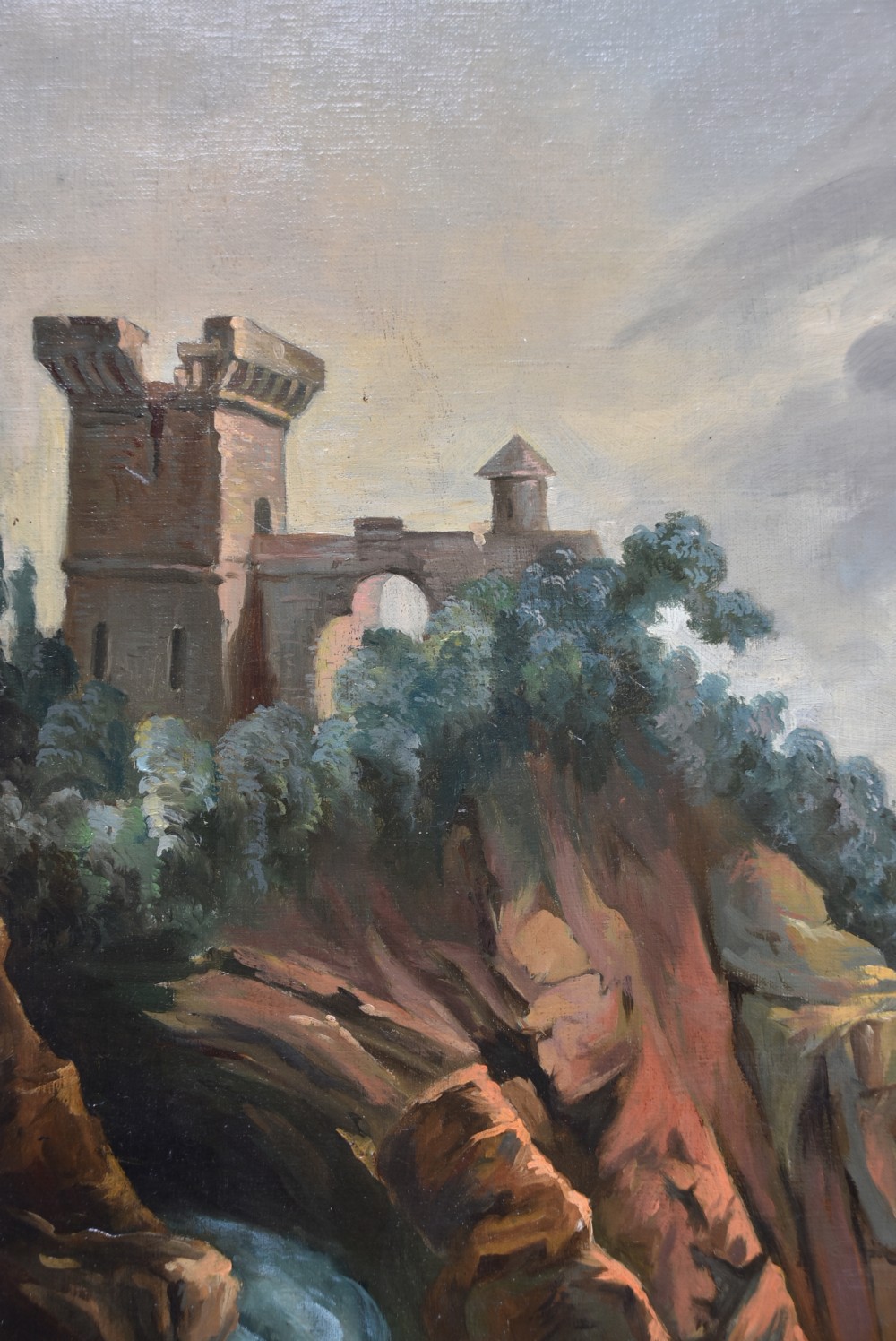 An 18th-century classical landscape oil painting on canvas featuring a waterfall, rocky cliffs, and distant river set within a moulded giltwood frame. View VI