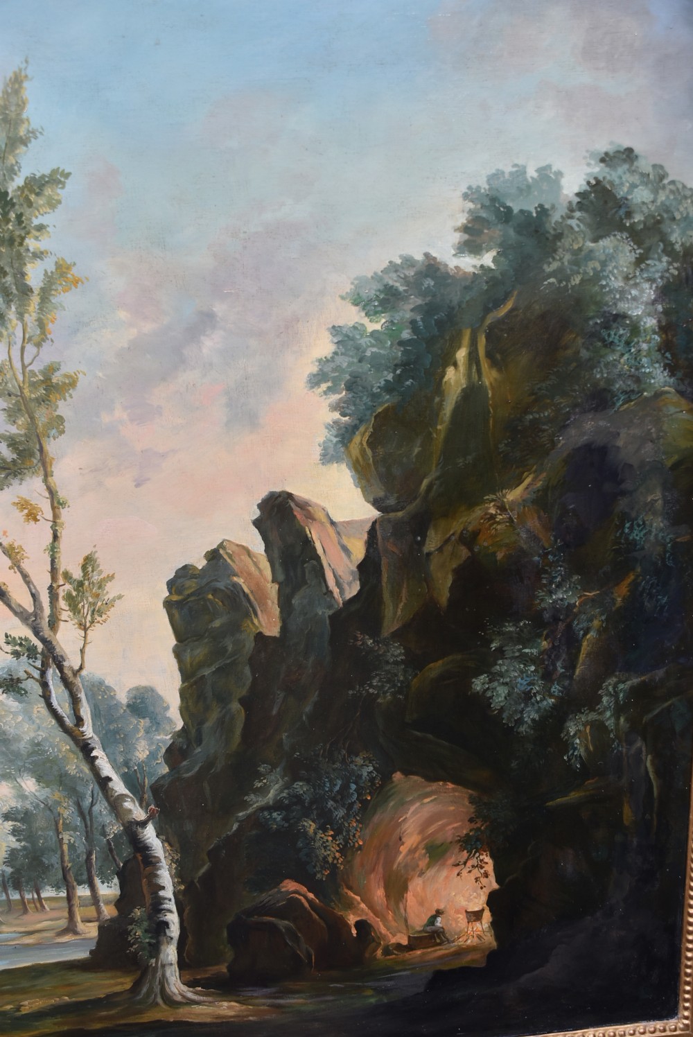 An 18th-century classical landscape oil painting on canvas featuring a waterfall, rocky cliffs, and distant river set within a moulded giltwood frame. View XII