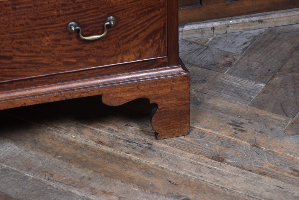 A tall Georgian mahogany secretaire chest featuring six graduated drawers, brass swan-neck handles, and ogee bracket feet. View XVIII