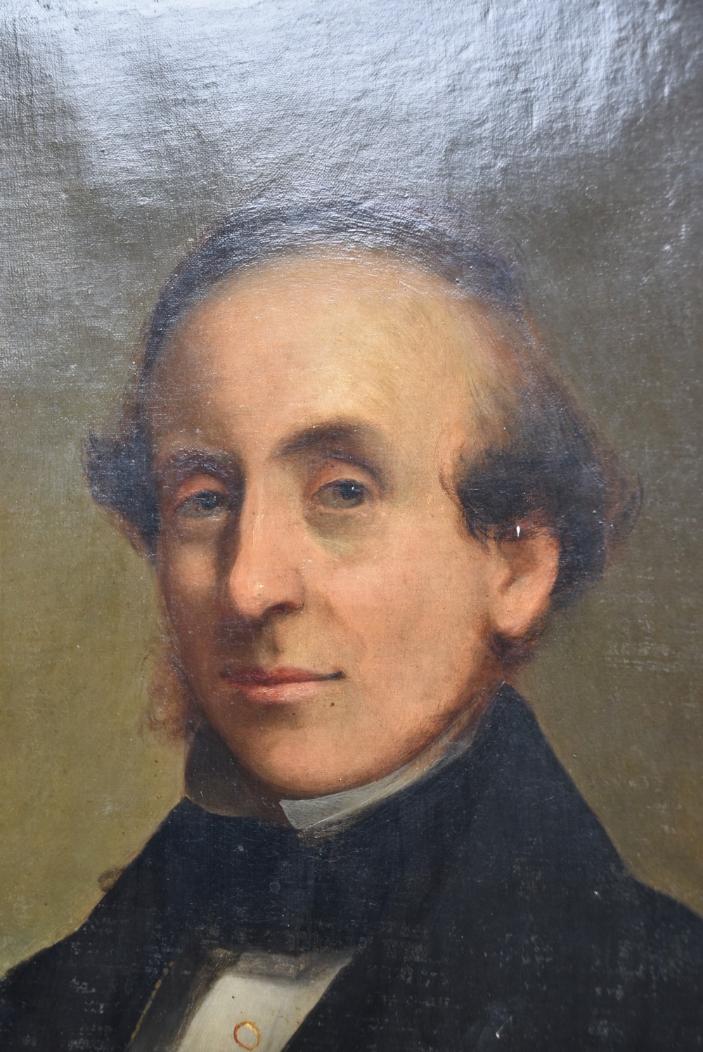 A nineteenth-century oil painting depicting a gentleman in dark formal wear within a carved gilded frame. View IV