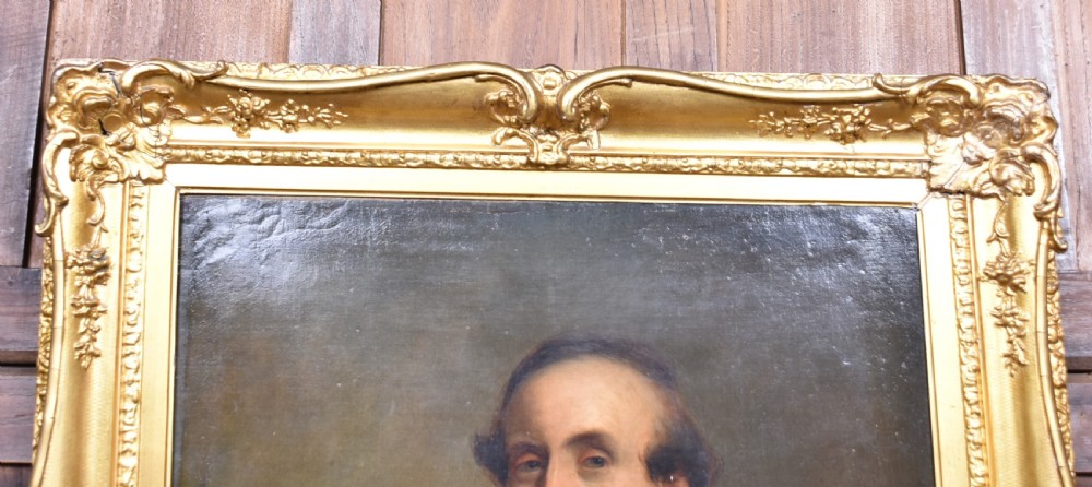 A nineteenth-century oil painting depicting a gentleman in dark formal wear within a carved gilded frame. View XI