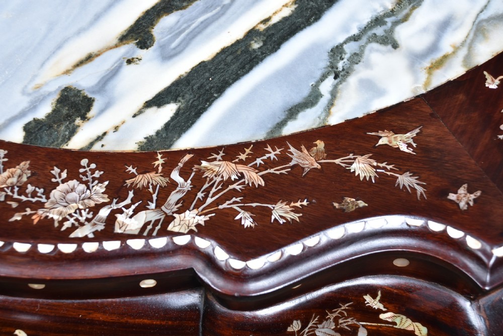 A circular dark hardwood centre table featuring intricate mother-of-pearl floral inlays, carved cabriole legs, and a grey and white variegated marble inset top. View VI