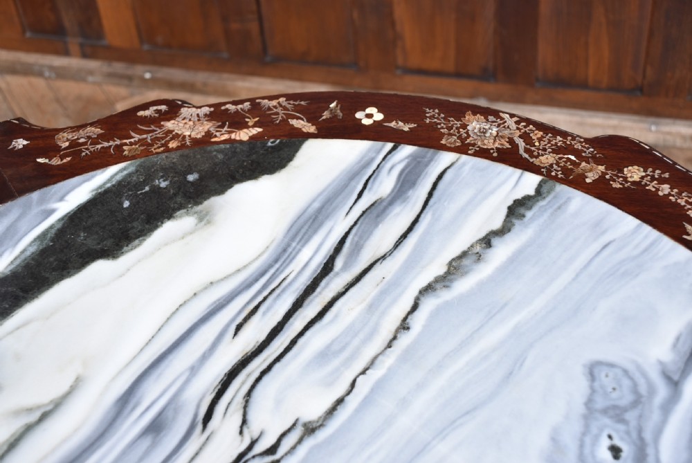 A circular dark hardwood centre table featuring intricate mother-of-pearl floral inlays, carved cabriole legs, and a grey and white variegated marble inset top. View XIII