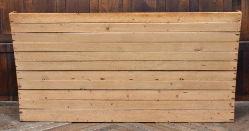A high-backed antique pine tavern bench featuring horizontal panelled construction and shaped side supports. View XII