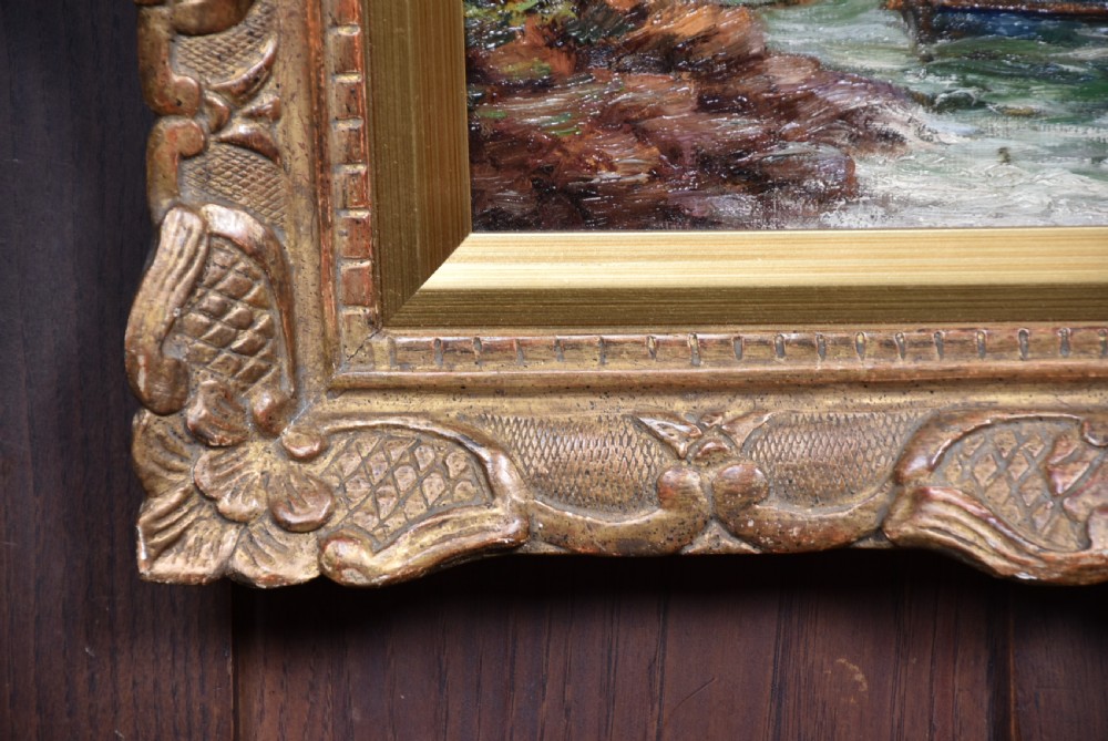 An impressionist oil painting depicting figures casting off in a rowing boat from a rocky shore, housed in an ornate carved gold gilt frame. View VI