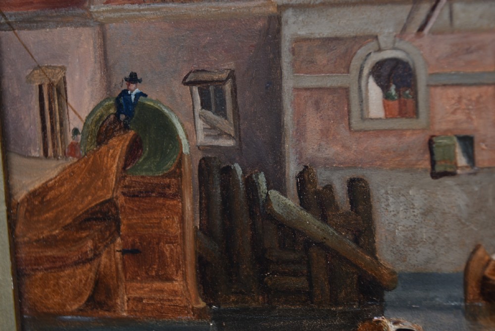 A framed oil painting depicting sailboats in a Dutch harbour beside historic brick buildings under a cloudy sky. View VI