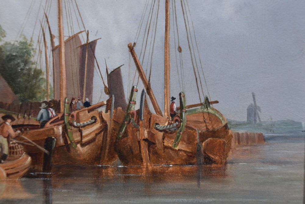 A framed oil painting depicting sailboats in a Dutch harbour beside historic brick buildings under a cloudy sky. View VIII