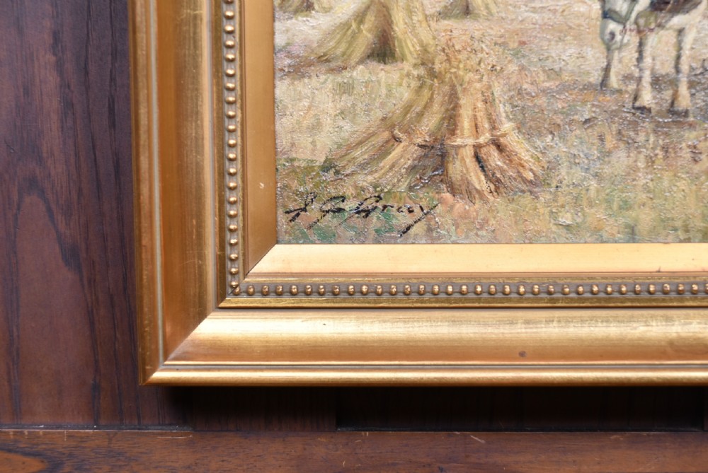 An oil painting set within a moulded gilt frame depicting farm workers and heavy horses gathering hay stooks in an open field under a cloudy sky. View VIII