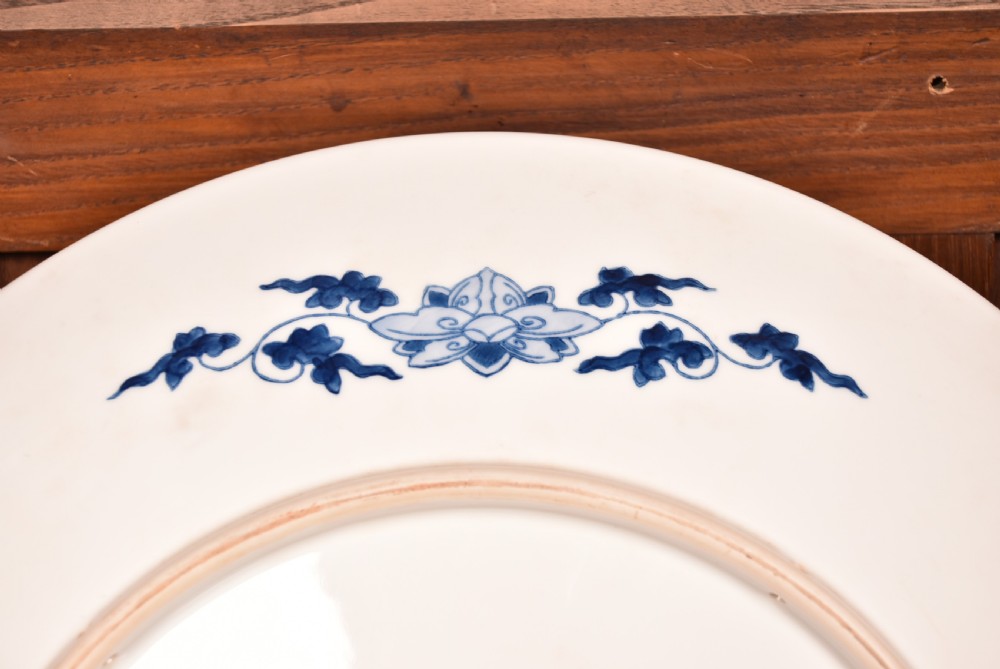 A large round Japanese Imari porcelain charger decorated with vibrant cobalt blue, terracotta red, and gilded floral and bird motifs. View X