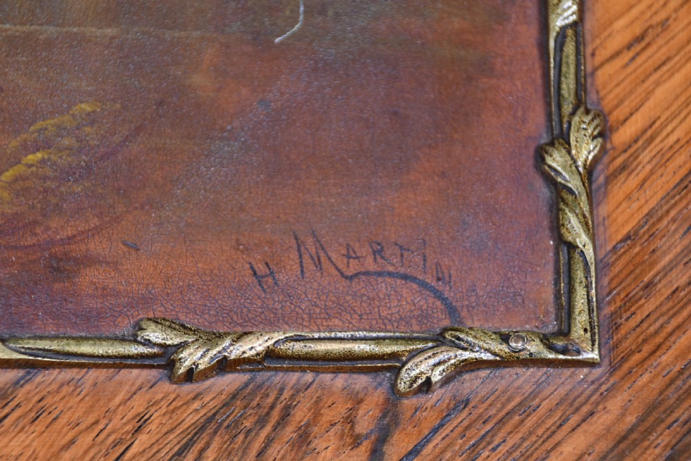 A 19th-century French rosewood bureau de dame featuring slender cabriole legs, brass mounts, a brass gallery top, and a hand-painted scene on the slanted flap front. View XIX