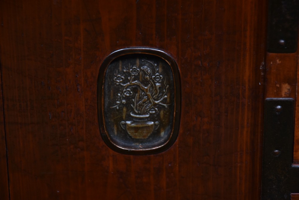 A Japanese keyaki wood merchant chest featuring multiple drawers, sliding central doors, and dark iron corner brackets and handles. View VIII