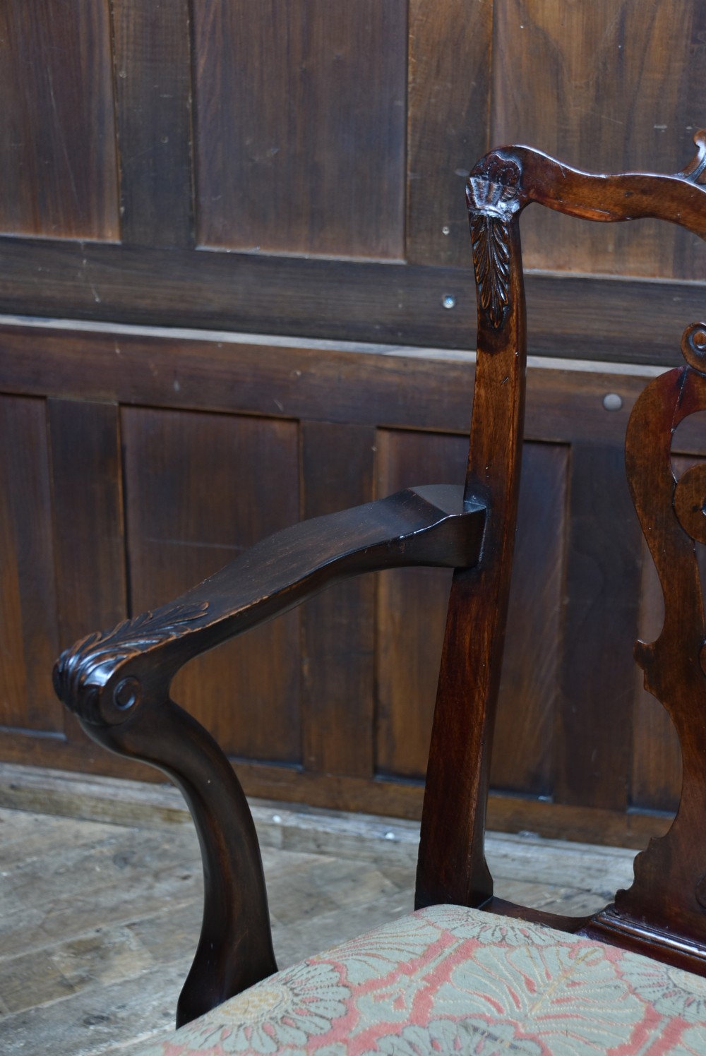 A Georgian mahogany open armchair featuring a pierced carved back splat, out-swept arms, patterned upholstery, and cabriole front legs. View IV