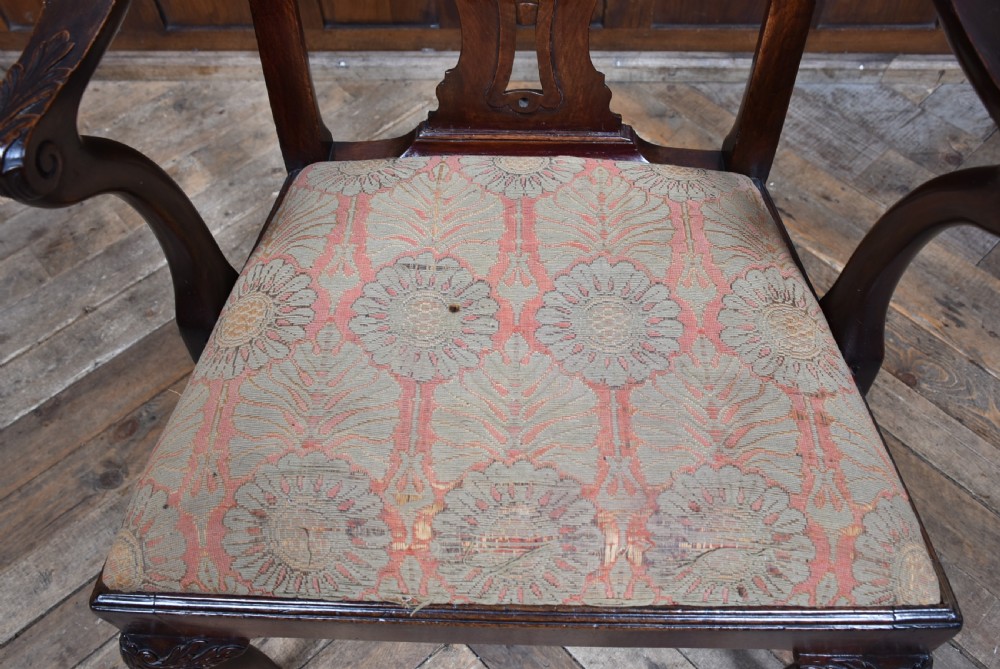 A Georgian mahogany open armchair featuring a pierced carved back splat, out-swept arms, patterned upholstery, and cabriole front legs. View VIII
