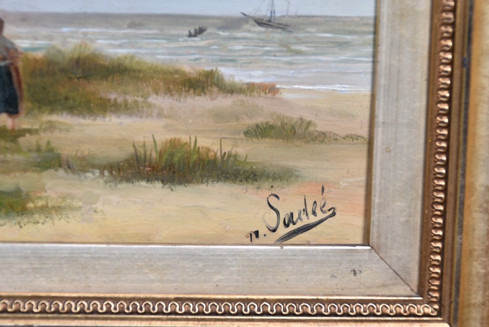 A pair of framed antique oil on board paintings depicting Dutch coastal scenes with figures on a sandy beach under muted skies. View IV