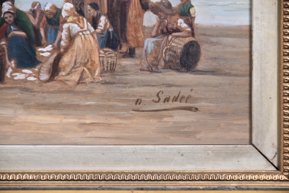 A pair of framed antique oil on board paintings depicting Dutch coastal scenes with figures on a sandy beach under muted skies. View VI
