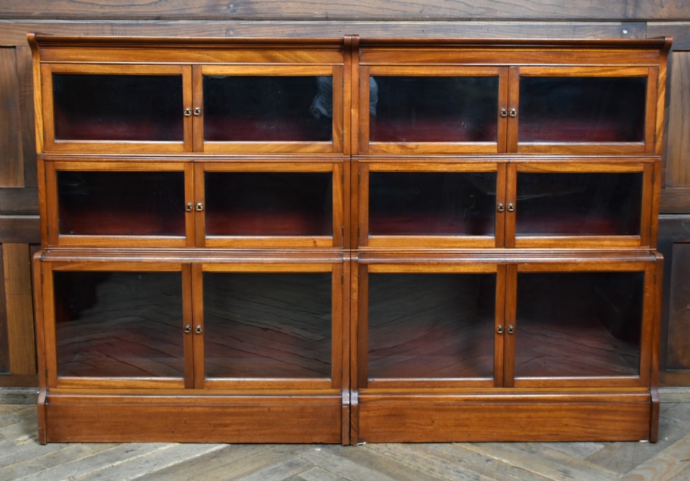 A pair of three-tier Edwardian mahogany sectional bookcases with glazed double doors and small brass handles placed side by side. View VIII