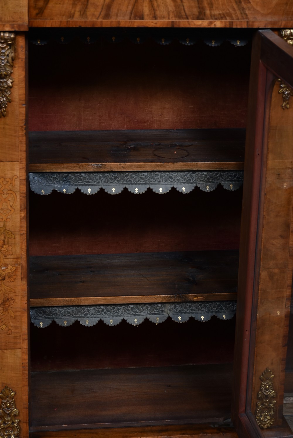 A low Victorian burr walnut breakfront bookcase featuring three arched glass doors, floral marquetry inlay, and gilt bronze mounts. View XIII