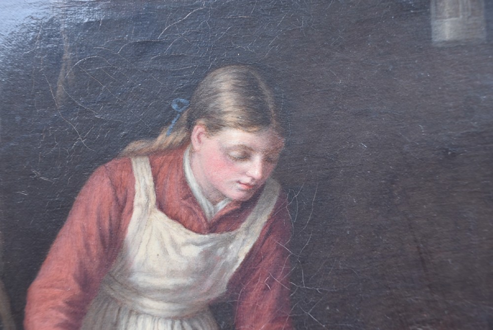 An oil painting depicting a woman working in a barn chopping vegetables beside a basket, housed within a gold carved frame decorated with oak leaves and acorns. View VII