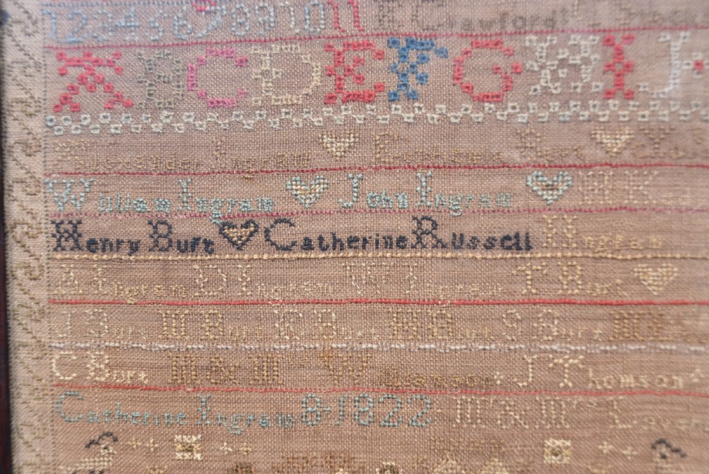 An early nineteenth-century framed Scottish needlework sampler featuring embroidered alphabets, names, dates, and tree motifs on linen. View III