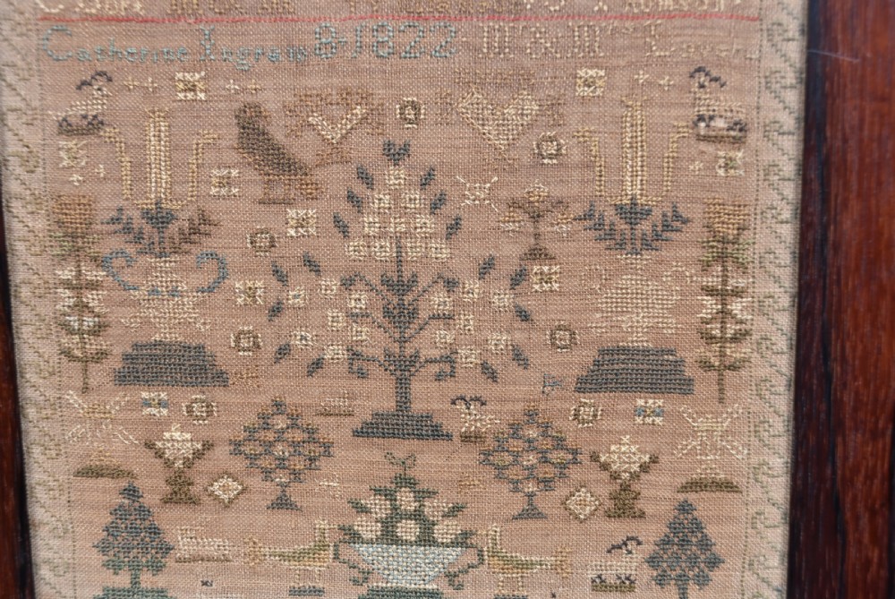 An early nineteenth-century framed Scottish needlework sampler featuring embroidered alphabets, names, dates, and tree motifs on linen. View VI