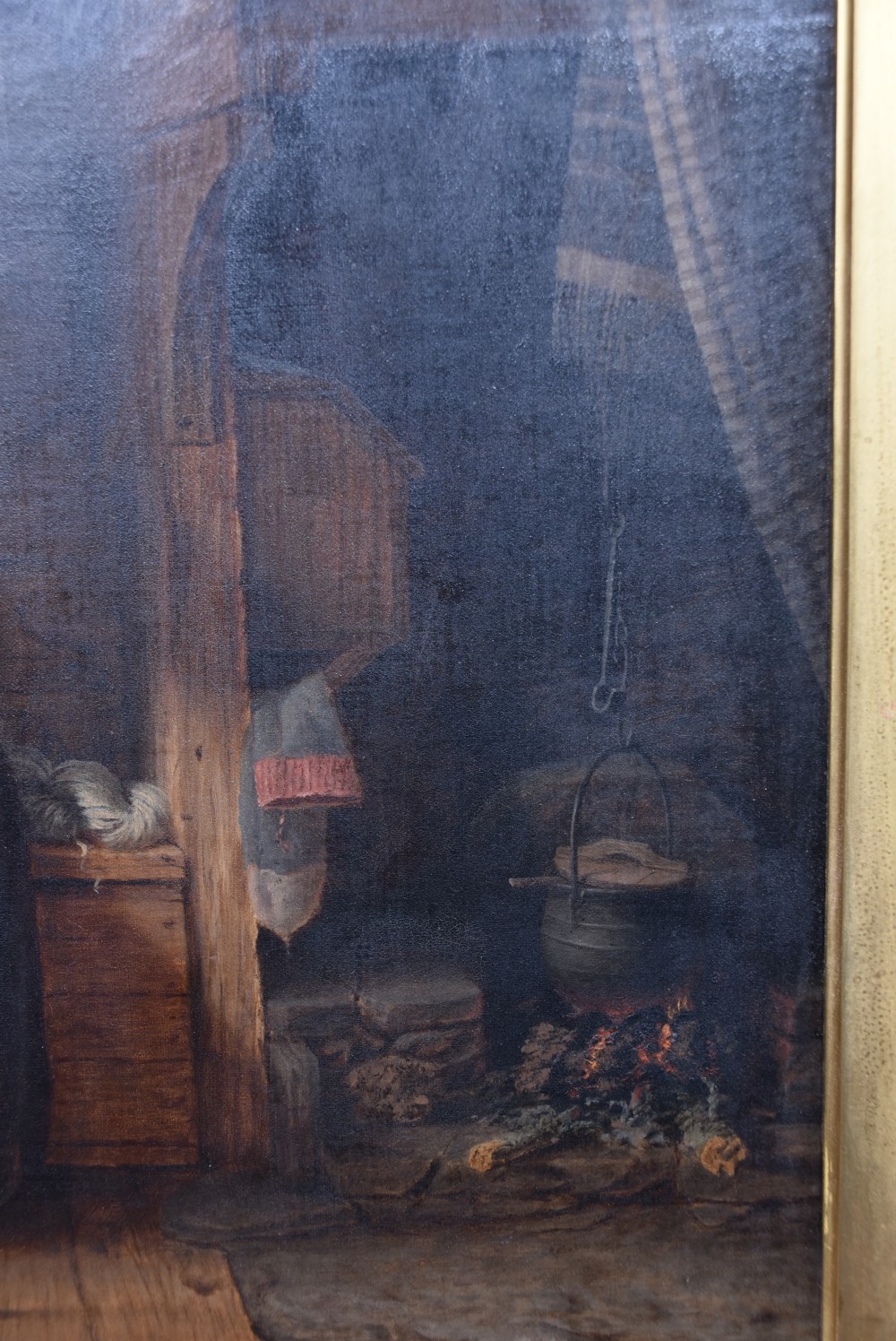 A 19th-century oil painting on wood panel by James Kyd depicting a woman operating a spinning wheel inside a cottage, set within an ornate gilded frame. View V