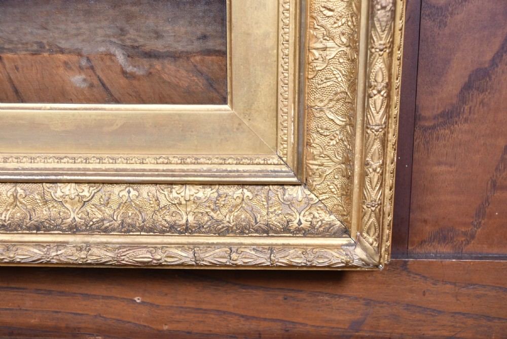 A 19th-century oil painting on wood panel by James Kyd depicting a woman operating a spinning wheel inside a cottage, set within an ornate gilded frame. View VI