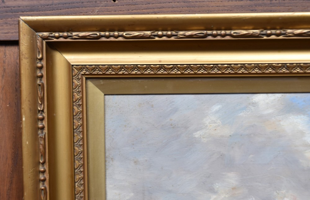 A framed oil painting depicting a herd of cattle grazing in a field beneath a dusk sky, enclosed within a decorative gold gilt frame. View XI