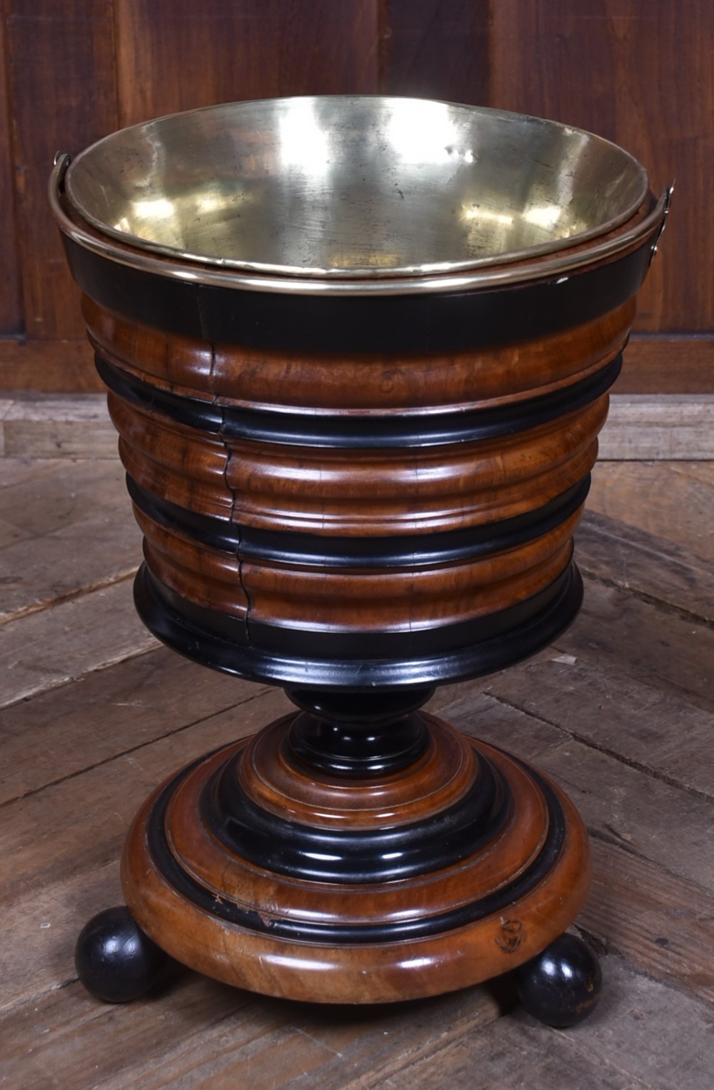 An early 19th-century Dutch teestoof bucket crafted from turned mahogany and ebonised wood with a brass swing handle and removable brass liner. View III