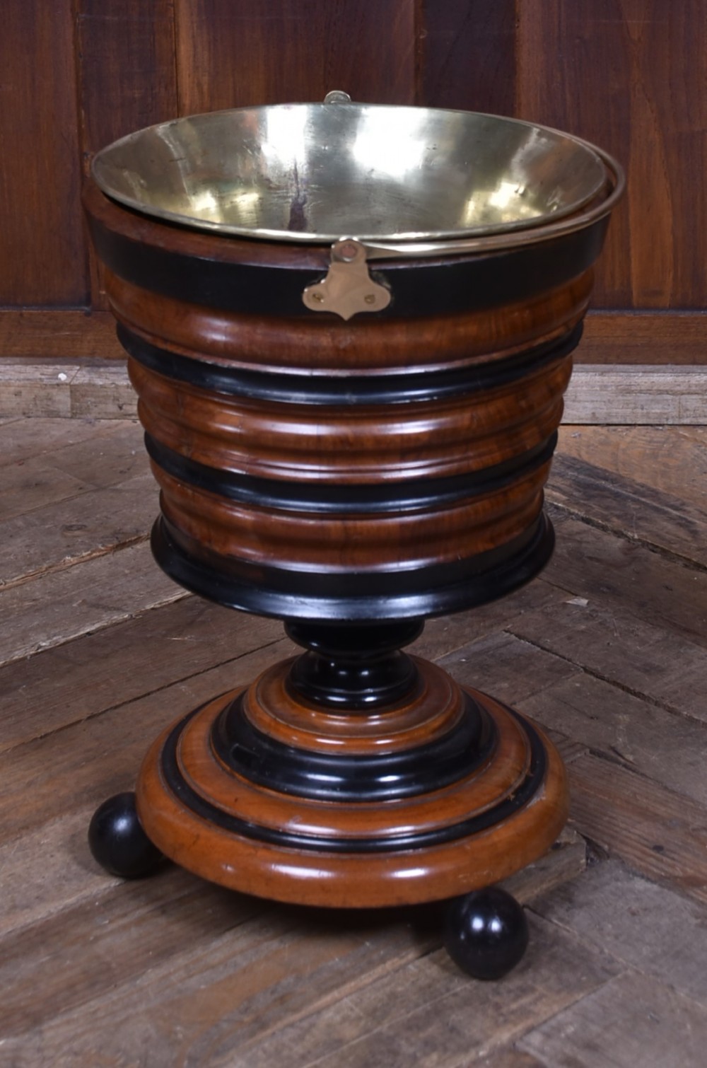 An early 19th-century Dutch teestoof bucket crafted from turned mahogany and ebonised wood with a brass swing handle and removable brass liner. View IV