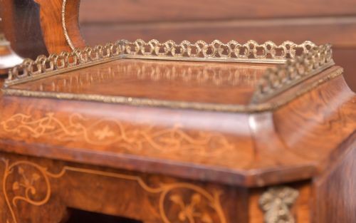 An antique French walnut ladys writing desk featuring floral marquetry, cabriole legs, brass mounts, and a raised upper section with glass cabinets and a central mirror. View II