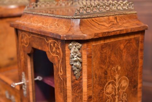 An antique French walnut ladys writing desk featuring floral marquetry, cabriole legs, brass mounts, and a raised upper section with glass cabinets and a central mirror. View X