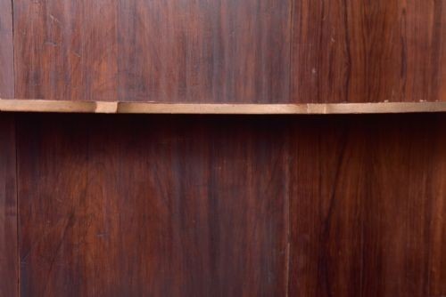 A nineteenth-century Dutch walnut display cabinet featuring a glazed upper section with individual glass panes and a lower cupboard with arched panelled doors resting on bracket feet. View VIII