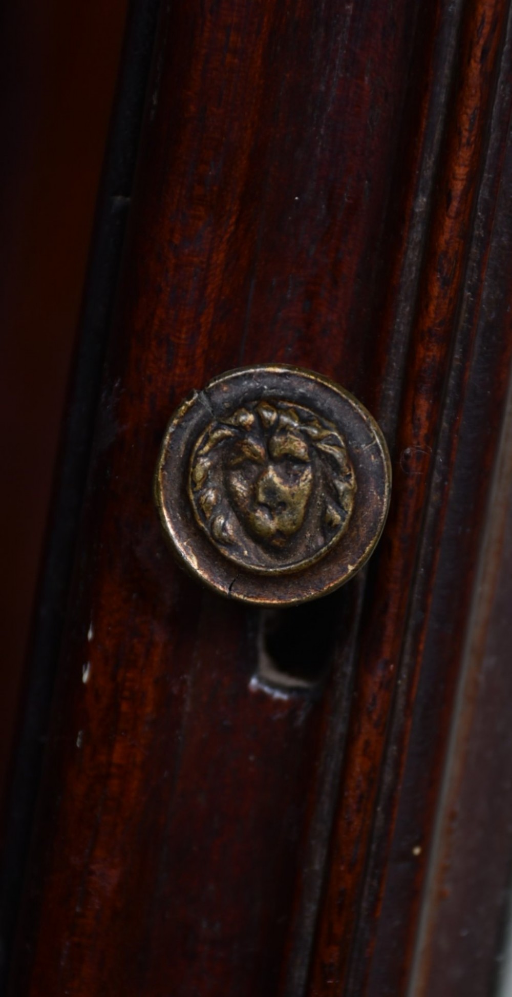 Victorian flame mahogany longcase clock featuring a swan-neck pediment, arched painted dial with floral spandrels, and a tall veneered trunk door. View XIII