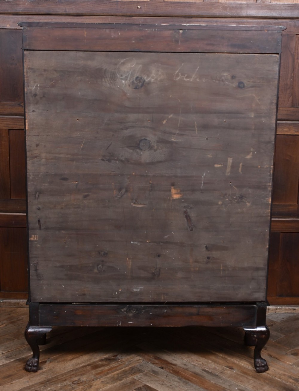 A dark mahogany Chippendale Revival display cabinet featuring double glazed doors with diamond astragal glazing, blind fretwork frieze, and cabriole legs on ball and claw feet. View XII